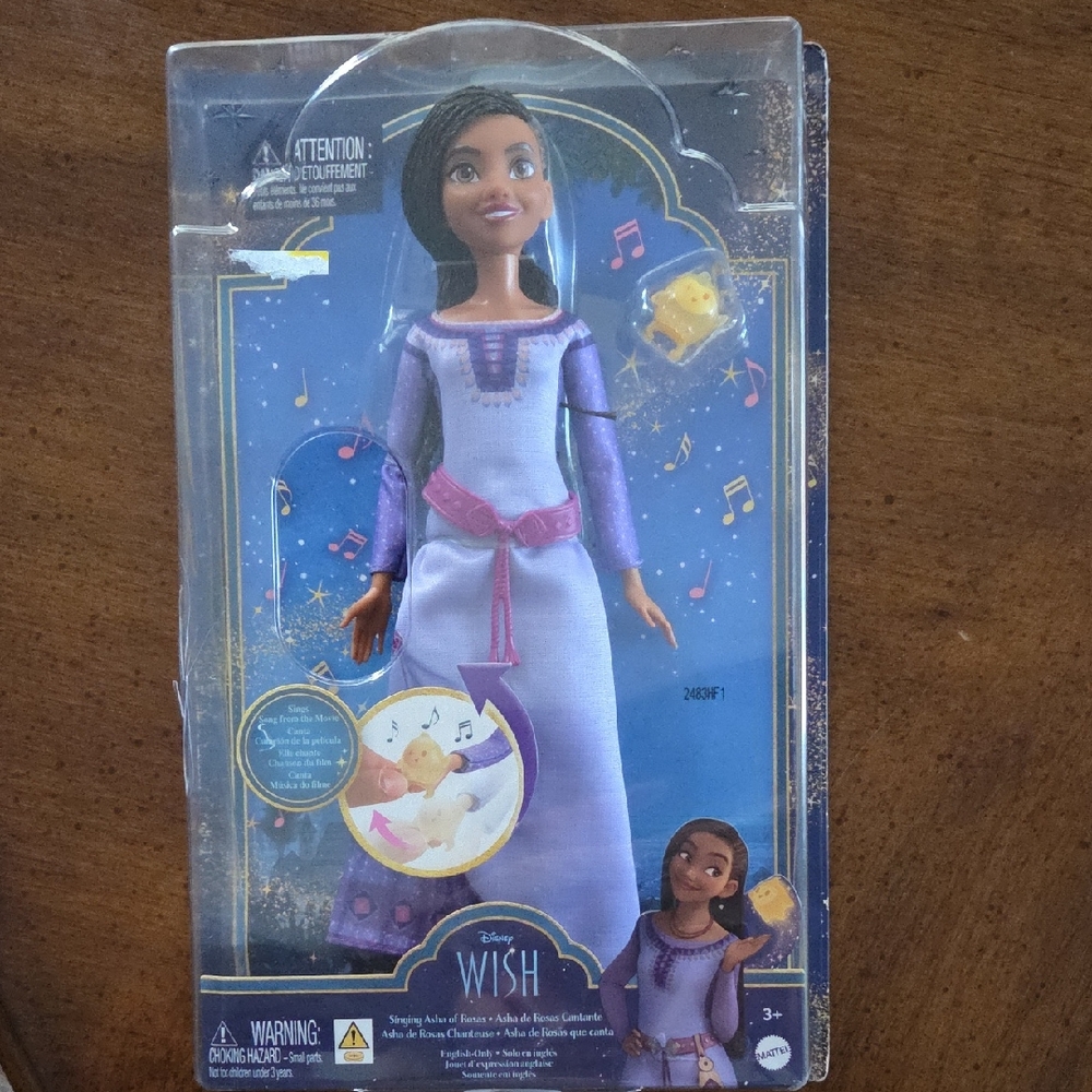 Disney purple and pink Asha fashion doll with yellow bird